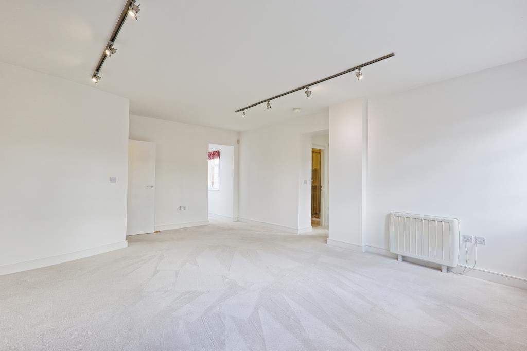 Lot: 6 - ATTRACTIVE TWO-BEDROOM APARTMENT IN CONVERTED FORMER HOSPITAL BUILDING - Living Room view toward kitchen and access to bedrooms